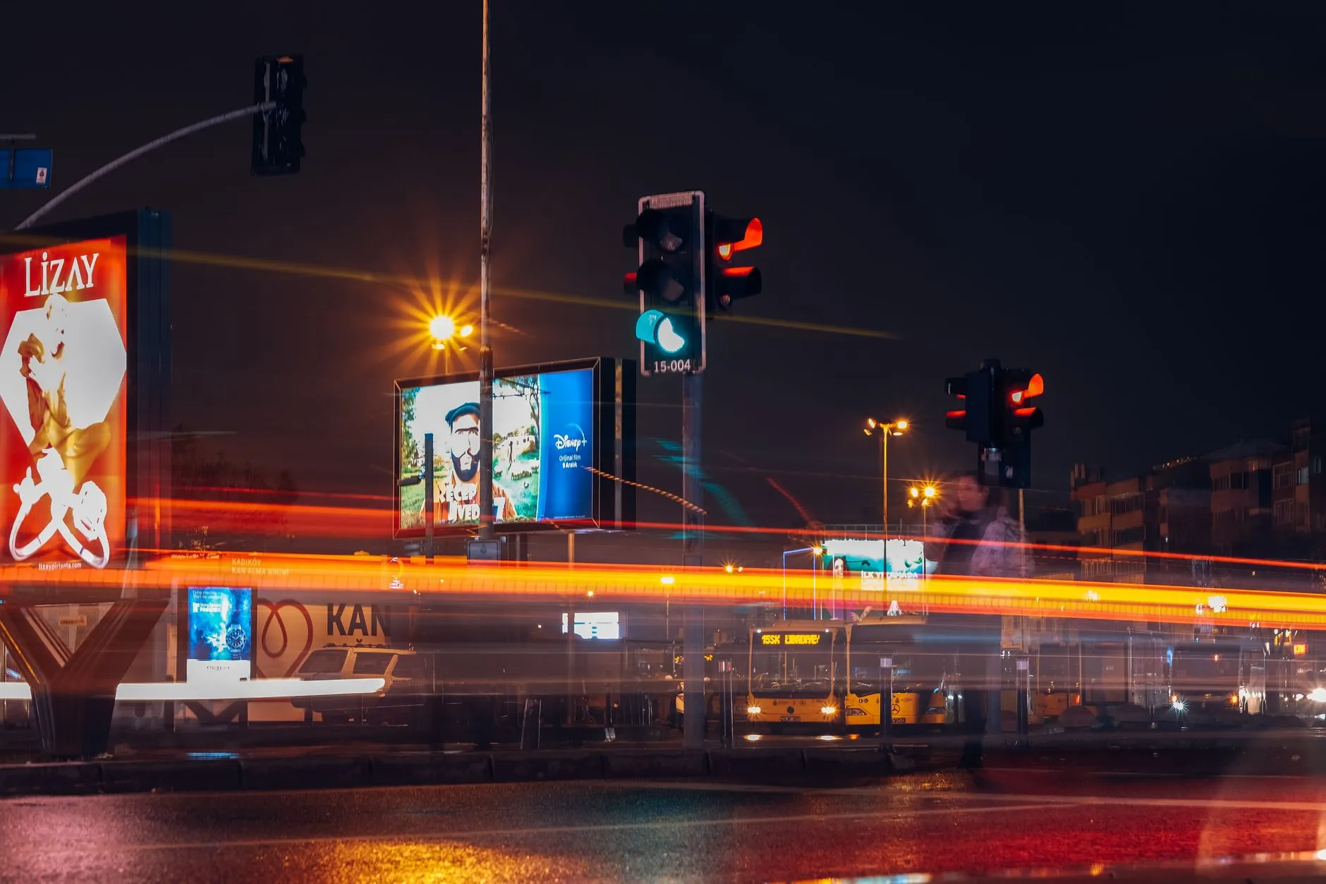 City billboards and light trails after dark